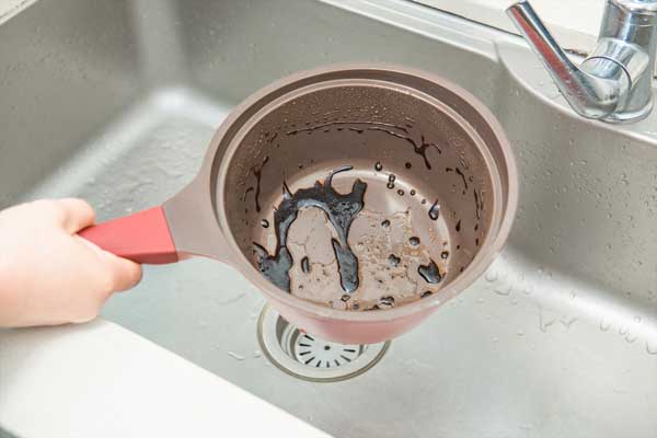 Bacon Grease in Pot Over Sink